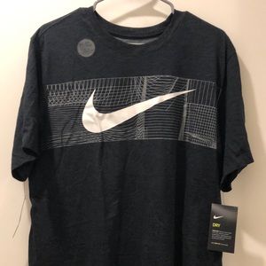 Black Nike Dri-Fit Men’s Tshirt. Logo design on front. Solid black. Size large.